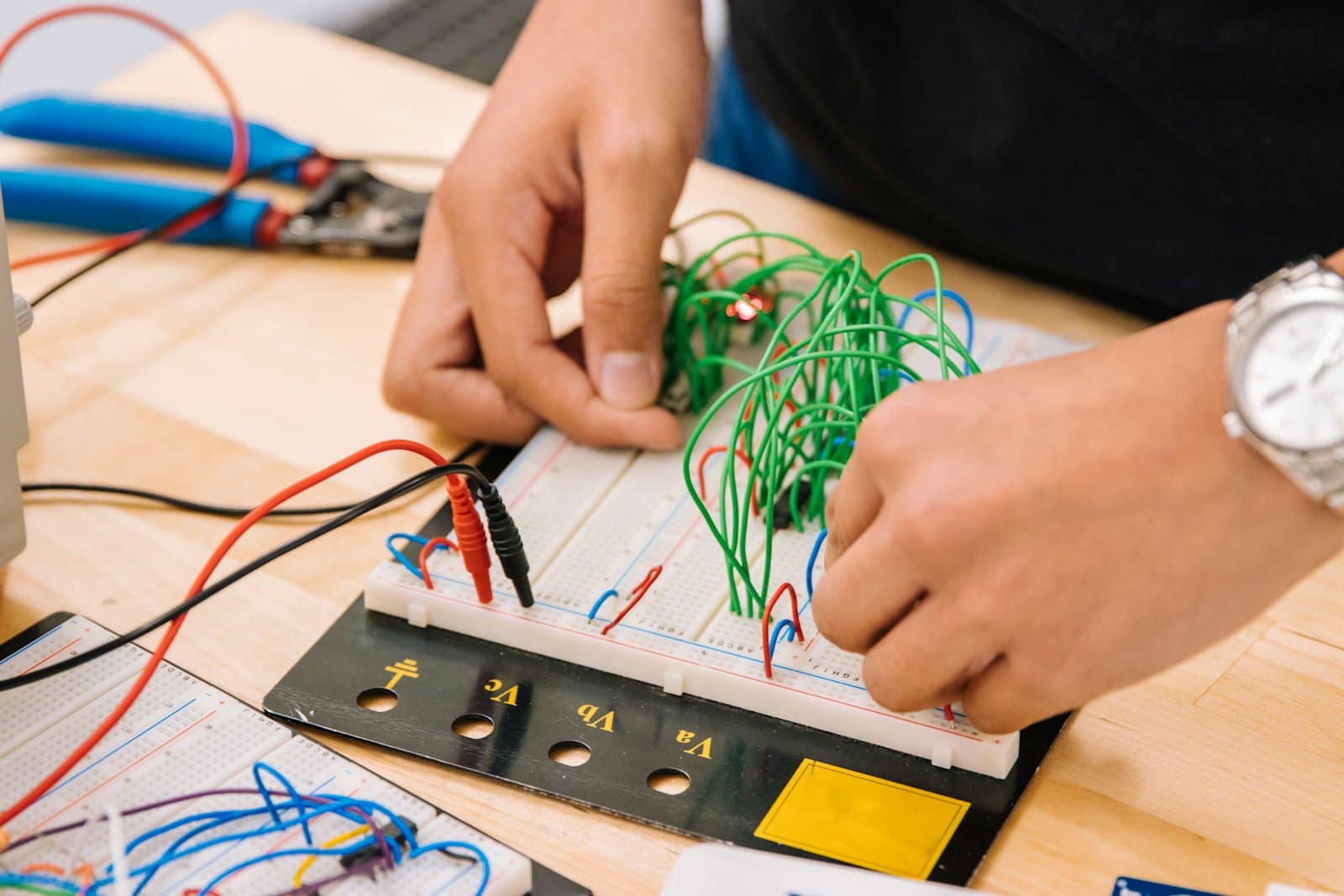 Students building circuits on a breadboard